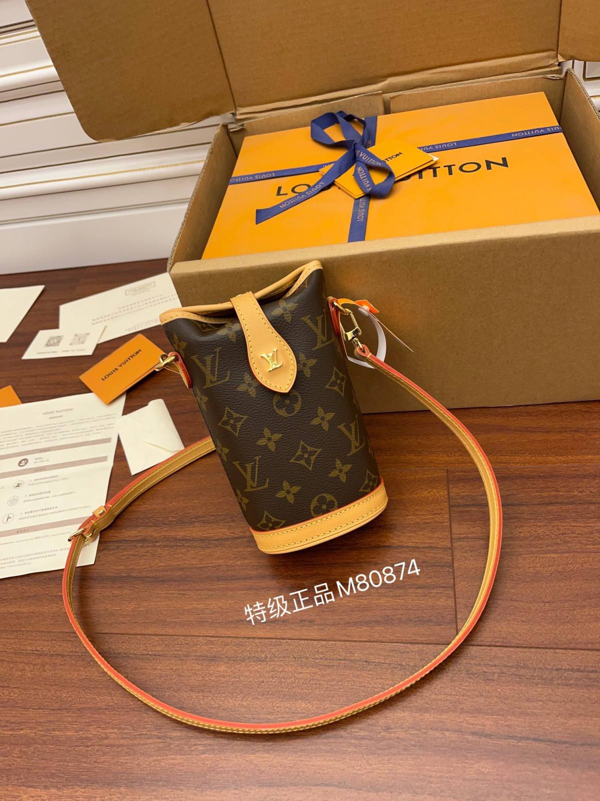 Ellebag’s Expert Replication of Louis Vuitton M80874 Fold Me Clutch: A Blend of Monogram Canvas and Leather-Best Quality Replica designer Bag factory in China