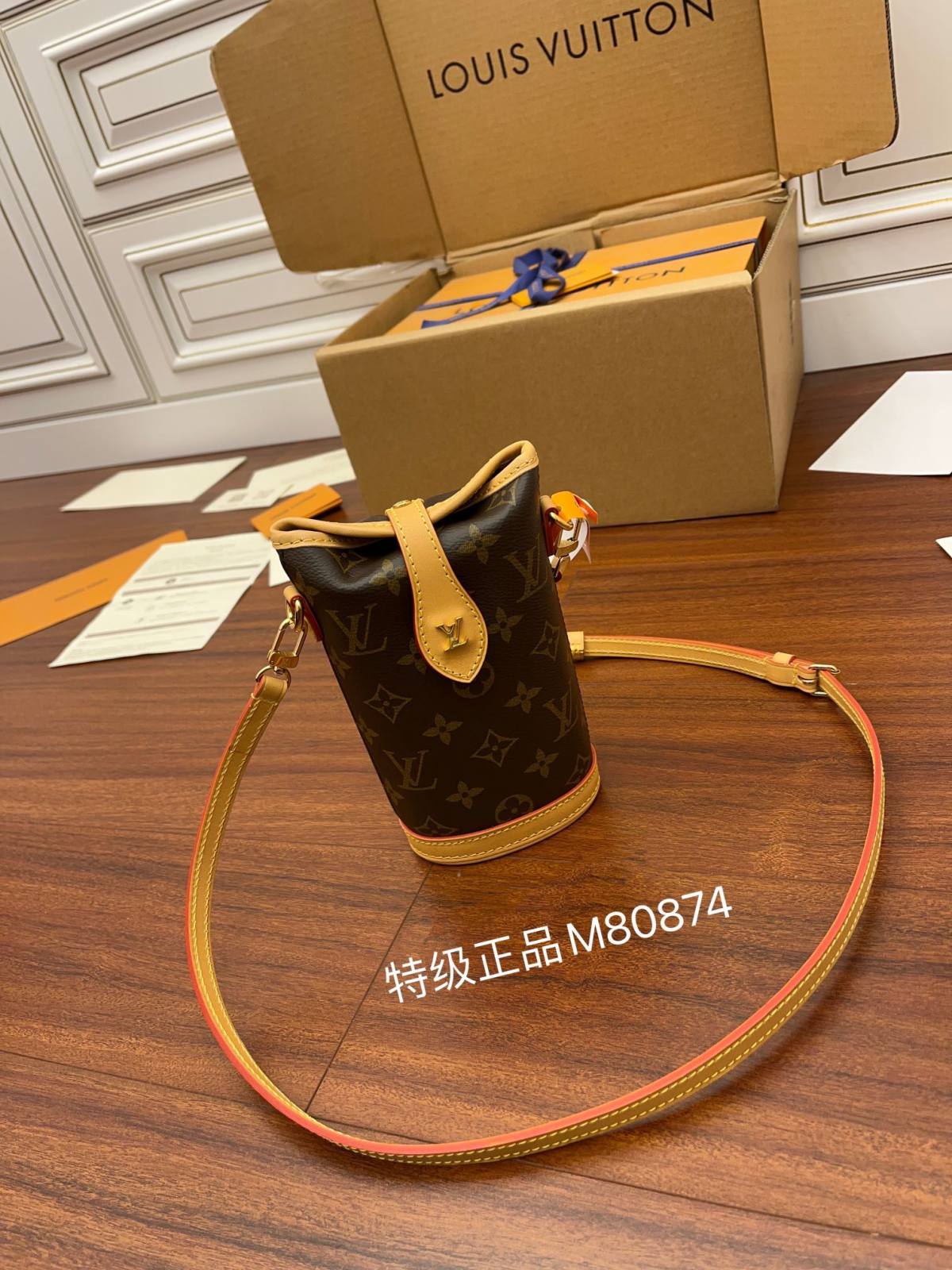 Ellebag’s Expert Replication of Louis Vuitton M80874 Fold Me Clutch: A Blend of Monogram Canvas and Leather-Best Quality Replica designer Bag factory in China